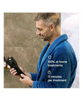 Man in blue robe using At Home Shockwave Therapy Device For Men To Bust Erectile Dysfunction And Kickstart Penile Blood Flow Naturally.