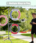 Person flying drone through Outdoor Drone Obstacle Course Kit For FPV Racing Indoor Quadcopter Gates For Beginner Friendly Practice