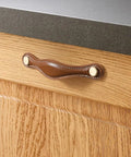 Installed brown leather drawer pull on wood cabinet with zinc alloy base, part of Leather Drawer Pulls 5 Pack, 5 Inch 128mm Leather Handles.