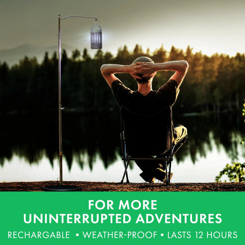 360 Degree UV Bug Zapper for Indoor and Outdoor Use hanging on pole near seated person outdoors.