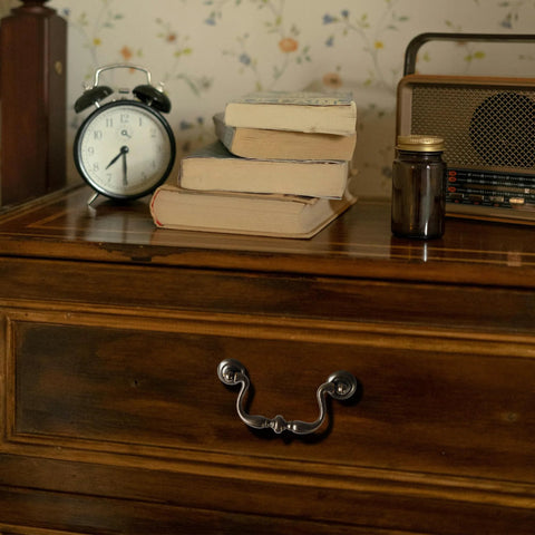 Oil Rubbed Bronze Drop Bail Drawer Pulls 4 Pack 4 Inch Center to Center colonial style on wooden dresser with traditional bead center