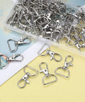 50 Piece Rock Solid Zinc Alloy Keychain Clips And D Ring Lanyard Hooks With Swivel Lobster Clasps Rust Proof Hardware For Bags and Custom Crafting in a clear container.