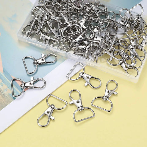 50 Piece Rock Solid Zinc Alloy Keychain Clips And D Ring Lanyard Hooks With Swivel Lobster Clasps Rust Proof Hardware For Bags and Custom Crafting in a clear container.