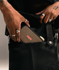 Ultra Portable 5W Smart Guitar Amp With Bluetooth Speaker Headphone Amp And Mobile App For Electric Acoustic Or Bass Guitars 33 Amps 43 Effects Custom Presets 50,000 ToneCloud Tones being placed in a black bag
