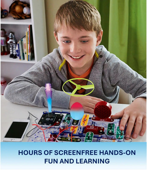 Child using Light Up Learning With This Electronics Exploration Kit Featuring 175 Plus STEM Projects at a desk with parts visible