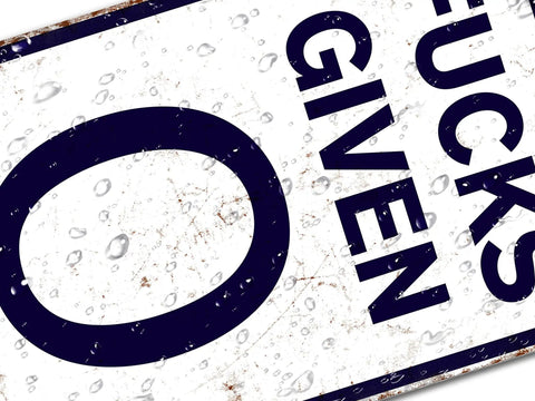 Close-up of Heavy Duty Badass Zero Given Metal Sign For Man Cave Garage Wall Decor Rust Proof Vintage Bar Art 12x8 Inch with water droplets.