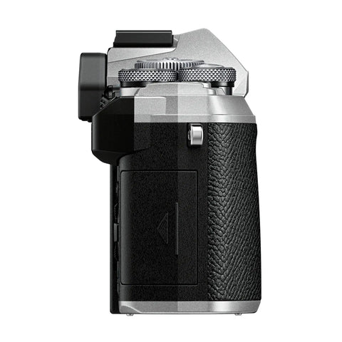 Side view of Rugged Micro Four Thirds Weather Sealed Camera With 5 Axis Image Stabilization, textured grip, silver top.