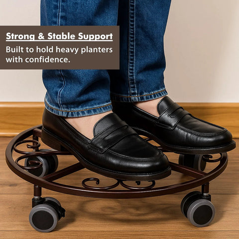 Person standing on Three Pack Heavy Duty Metal Plant Caddies With Wheels 13.5 Inch rolling plant stand dolly, showcasing strength.