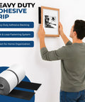 Rock Solid Heavy Duty Hook And Loop Tape Black Self Adhesive Fastener Strips applied to secure a picture frame on the wall.