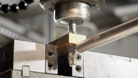 Close-up of 12-24 thread tap being used on metal with drill press for precise internal threading work. Level Up Your Weekend Builds With This 12 24 Thread Tap And Drill Bit Combo Set Sporting No Skate Pilot Tips For Bulletproof Right Hand Internal Threading Work.