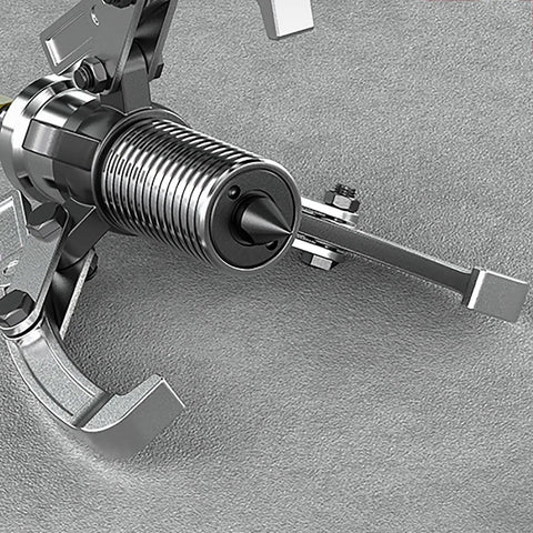 Close-up of Heavy Duty 50 Ton Hydraulic Gear Puller With Split Type Bearing Puller Tool on textured surface