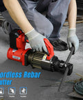 Loschen Cordless Electric Hydraulic Rebar Cutter With Li-ion Battery For Portable Handheld Cutting Up To 7/8 Inch Diameter Steel Bars Heavy Duty Power Tool For Construction And DIY Projects cutting through rebar on a concrete surface.