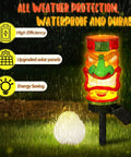 Front view of 2 Pack 17 Inch Tiki Solar Lights Outdoor Garden Decor Waterproof Resin Statues That Automatically Glow At Night.