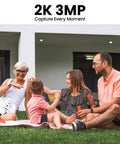 Family enjoying outdoors on a lawn in front of a modern home, promoting Solar Powered Outdoor Security Camera With 2K Video.