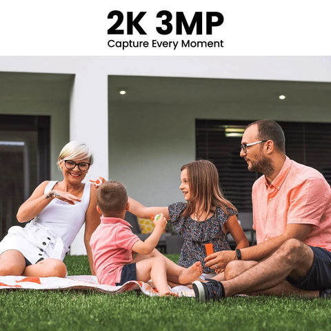 Family enjoying outdoors on a lawn in front of a modern home, promoting Solar Powered Outdoor Security Camera With 2K Video.