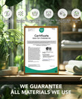 Oeko-Tex Standard 100 certificate displayed in a wooden frame with green plants and towels, showcasing eco-friendly materials.