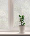 Texture Twelve Window Privacy Film With Dimensional Textured Glass Look Static Cling Non Adhesive Privacy Film For Homes And Offices Blocks View Without Darkening UV Protection Made In USA 36 By 72 Inch displayed on window with plant