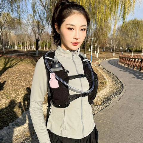 Ultra Light Hydration Vest With Built In Water Reservoir For Runners And Adventurers worn by woman outdoors