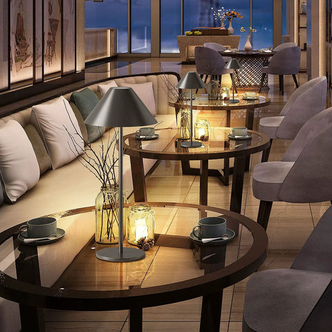 Modern LED Rechargeable Cordless Table Lamp With Dimmable Eye Protection Light on a glass table in a cozy lounge setting