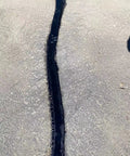 Pro Grade Premium Asphalt Tarmac Parking Lot Joint And Crack Sealer Tape Hot Filler II installed on pavement, 2in x 50ft, 3mm