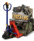 Huge 11023 Lbs Electric Pallet Jack Walkie Truck With Auto Brake And Fast Charge For Heavy Industrial Work Moving Cars And Machinery On Job Sites next to a large machine.