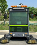 Heavy Duty Commercial Ride On Industrial Sweeper For Warehouses And Factories, front view of the machine with brushes.