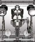 Top Tier Chrome Espresso Machine Cranking Out Perfection With A Rotary Pump Heat Exchanger And PID Temp Control For Smooth Daily Shots At Home Or Hustling Small Cafe Setup, featuring dual gauges and control levers.