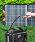 Person using All-In-One 7-In-1 Solar Panel Connector Kit With DC Adapters on Yeti power station and solar panel