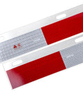 Two red safety reflex plates for mud flap installation, made of reflective material for enhanced visibility and safety.