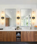 Bathroom interior with Battery Operated Wall Sconces Set Of 2 With Dimmable Remote, Black Gold Finish, Glass Shade next to mirrors