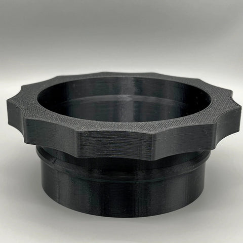 Front view of 4-inch MagDuct port quick-disconnect dust collector fitting, black plastic