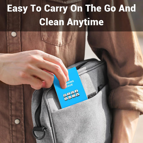 Blue lens cleaning tissue tag being inserted into a gray backpack pocket.