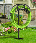 Upgraded Garden Hose Holder With Metal Reel And Detachable Tool Storage Basket in a garden setting
