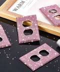 Pink Rhinestone Light Switch Covers Set of 4 Sparkly Wall Plate Covers on black surface with scattered crystals