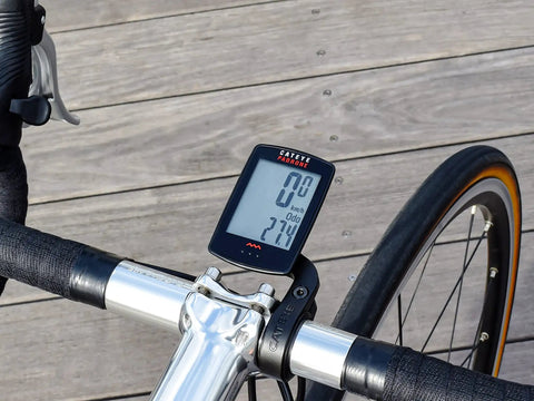 Padrone Wireless OF-100 Bike Computer With Oversized Display And Out Front Mount on a road bike's handlebars.
