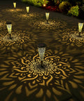 Six Pack Solar Outdoor Garden Lights With Mandala Pattern, Warm Amber Glow lighting up a pathway with intricate design on ground