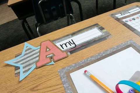 Home Sweet Classroom Flat Name Plates 36 Pack For Labels Centers And Storage Eleven And A Half By Three And A Half Inches Durable Laminatable Name Tags For Student Names And Substitutes displayed on a wooden desk.