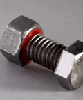 Metal bolt and nut treated with Purple Thread Locker TL71 25125 Adhesive, showing enhanced vibration resistance and sealing.