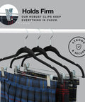 Ultra Thin Velvet No Slip Pants Hangers With Clips 10 Pack holding plaid pants on a rod, showcasing anti-slip clips.