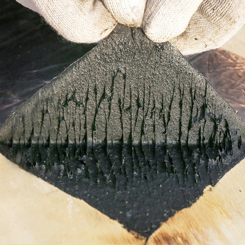 Close-up of Straight Up Heavy Duty Self Adhesive Bitumen Roof Repair Tape showcasing its textured underside for effective sealing.