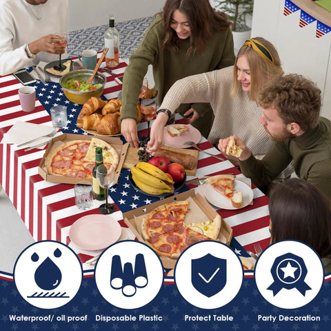People enjoying a meal on a Patriotic Fourth Of July Tablecloth Set Two Pack 54 By 108 Inches Plastic Outdoor Party Cover.