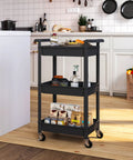 Three Tier Rolling Cart With Lockable Casters And Covered Top Board Great For Kitchen Office Bathroom Garden Or Laundry Room Mobile Storage Trolley That Keeps Your Stuff Easy To Access On The Go in a kitchen setting