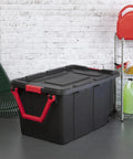 Two Pack 160 Quart Black Stackable Rolling Storage Bins with Heavy Duty Red Latches and Smooth Glide Wheels in garage setting.