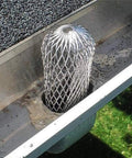 Four Pack Expandable Aluminum Gutter Downspout Guards and Leaf Filter Strainers installed in gutter, blocking debris.