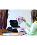 Heavy Duty Plug And Play Electric Comb Binding Machine Crushes Up To Three Hundred Pages With 1.5 Inch Coils Includes Auto Punch Action in use.