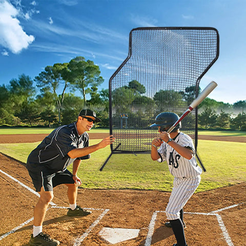 Coach and player using Baseball Z Screen Heavy Duty 7x5ft Portable Pitching Screen in a sunny field for batting practice.