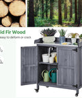 Mobile Outdoor Potting Bench Table With Castors On Wheels Solid Wood Workstation And Large Storage Cabinet Durable Metal Top Garden Station For Potting DIY Projects Flower Arranging And More Gray with plants on top and cabinet open