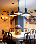 Half Chrome Gold Tipped LED Filament Bulbs Dimmable A19 6W 60W Equivalent Warm White 2700K E26 Base Antique Edison Style Decorative Light Bulbs Pack of 4 Anti Glare illuminating a festively decorated dining room showcasing Halloween decor with pumpkins and bats.