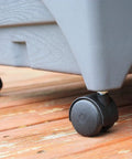 City Picker Raised Bed Grow Box With Self Watering System And Improved Aeration Mobile Garden casters on a wooden patio