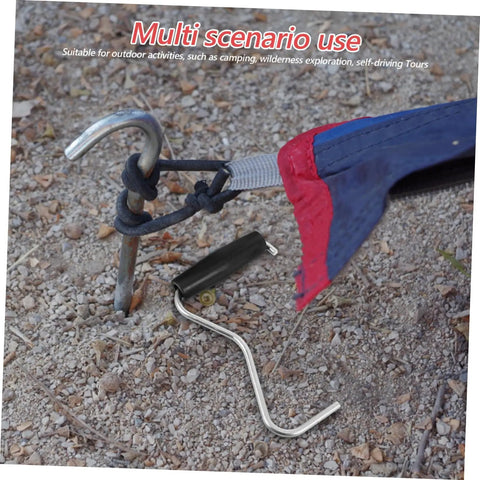 Tent Stake Puller Tool For Camping Peg Remover And Extractor on rocky ground with tent cord attached, showing lightweight design.